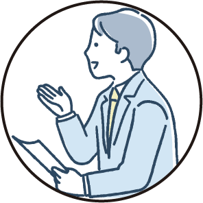 紙を持ちながら話しかけている男性